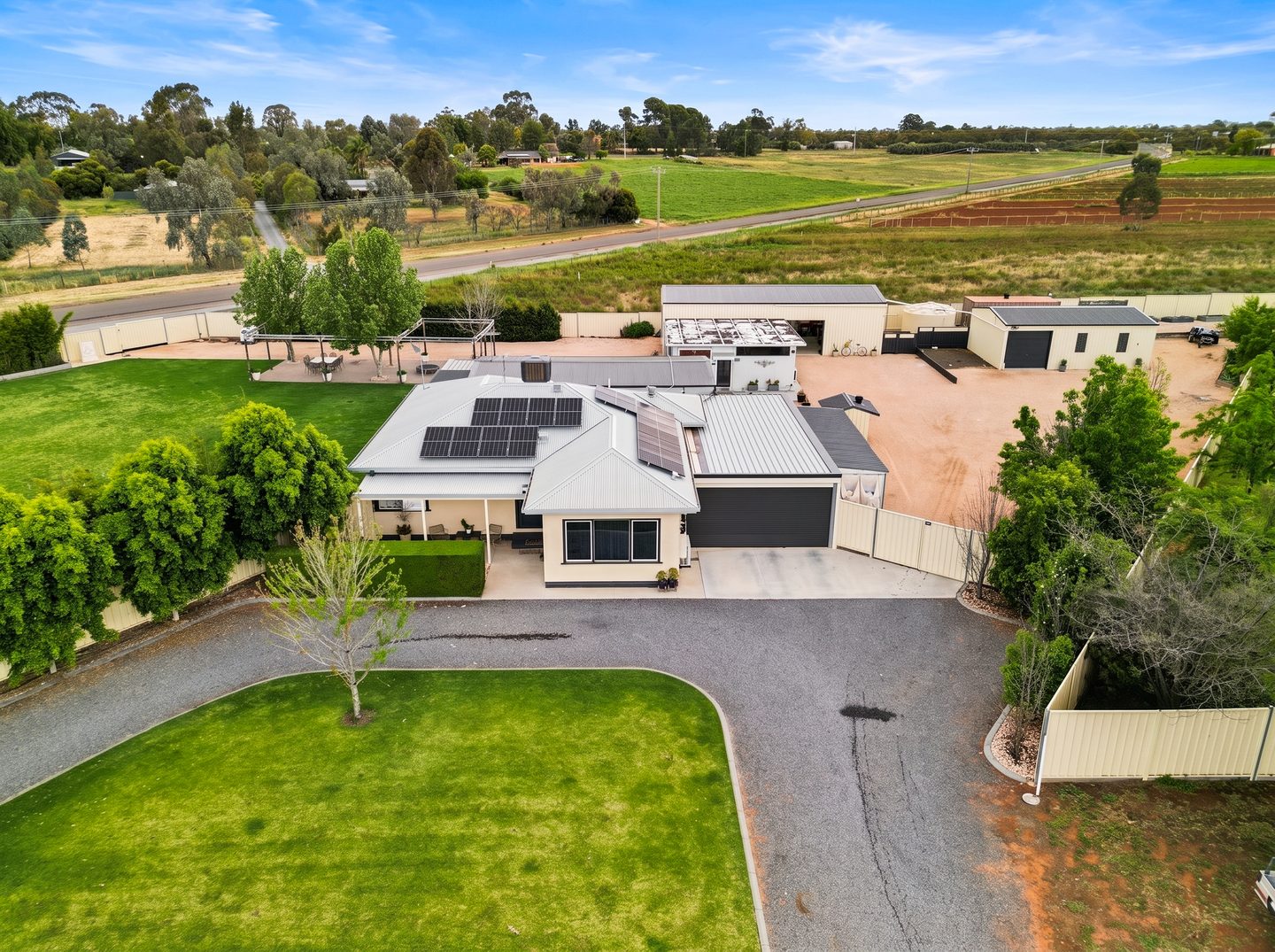 Aerial view of the residence and outbuildings