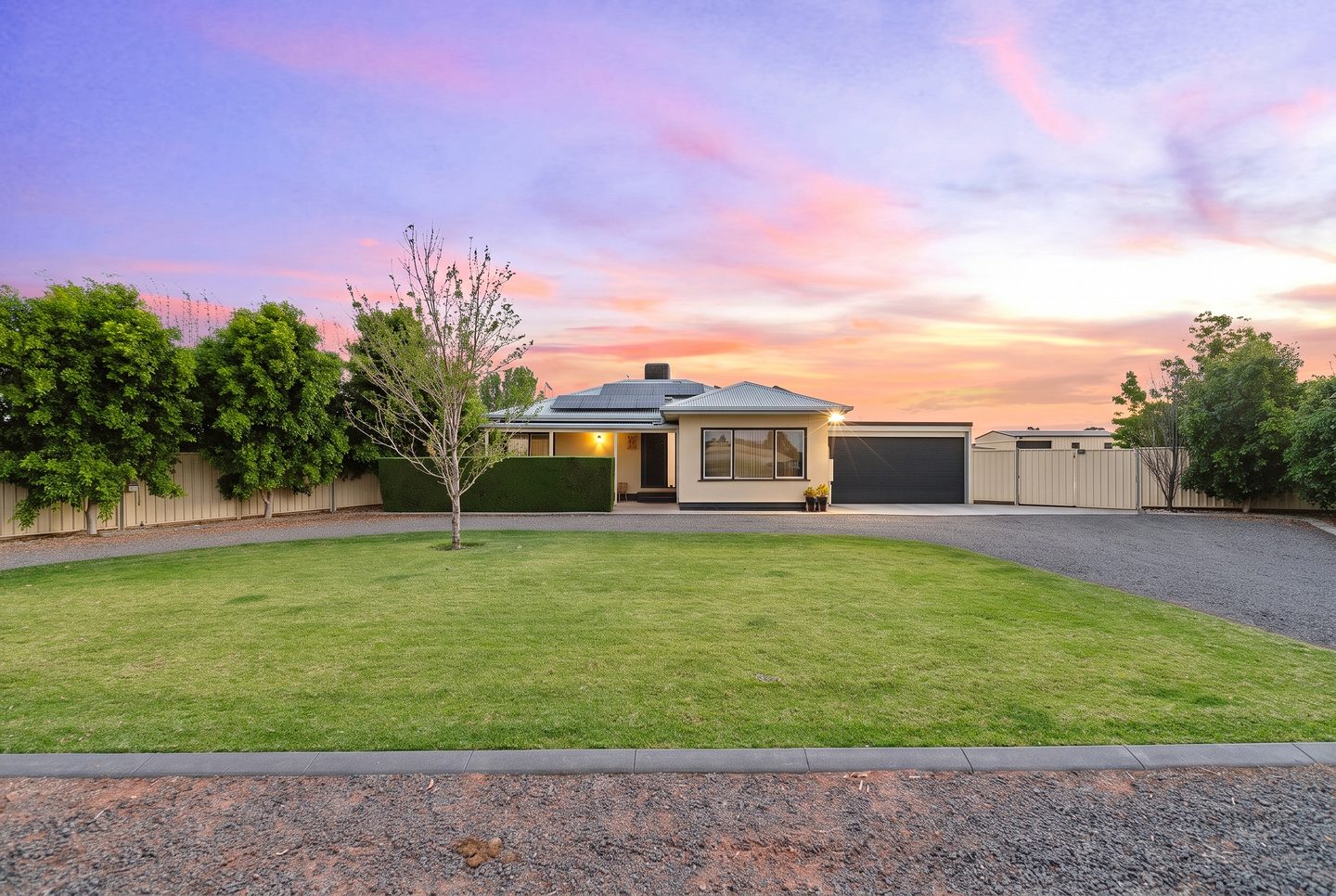 The residence and front lawn at dusk