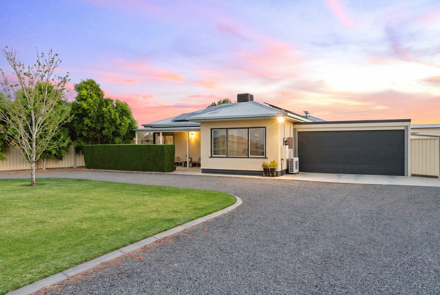 The curving driveway and front garden