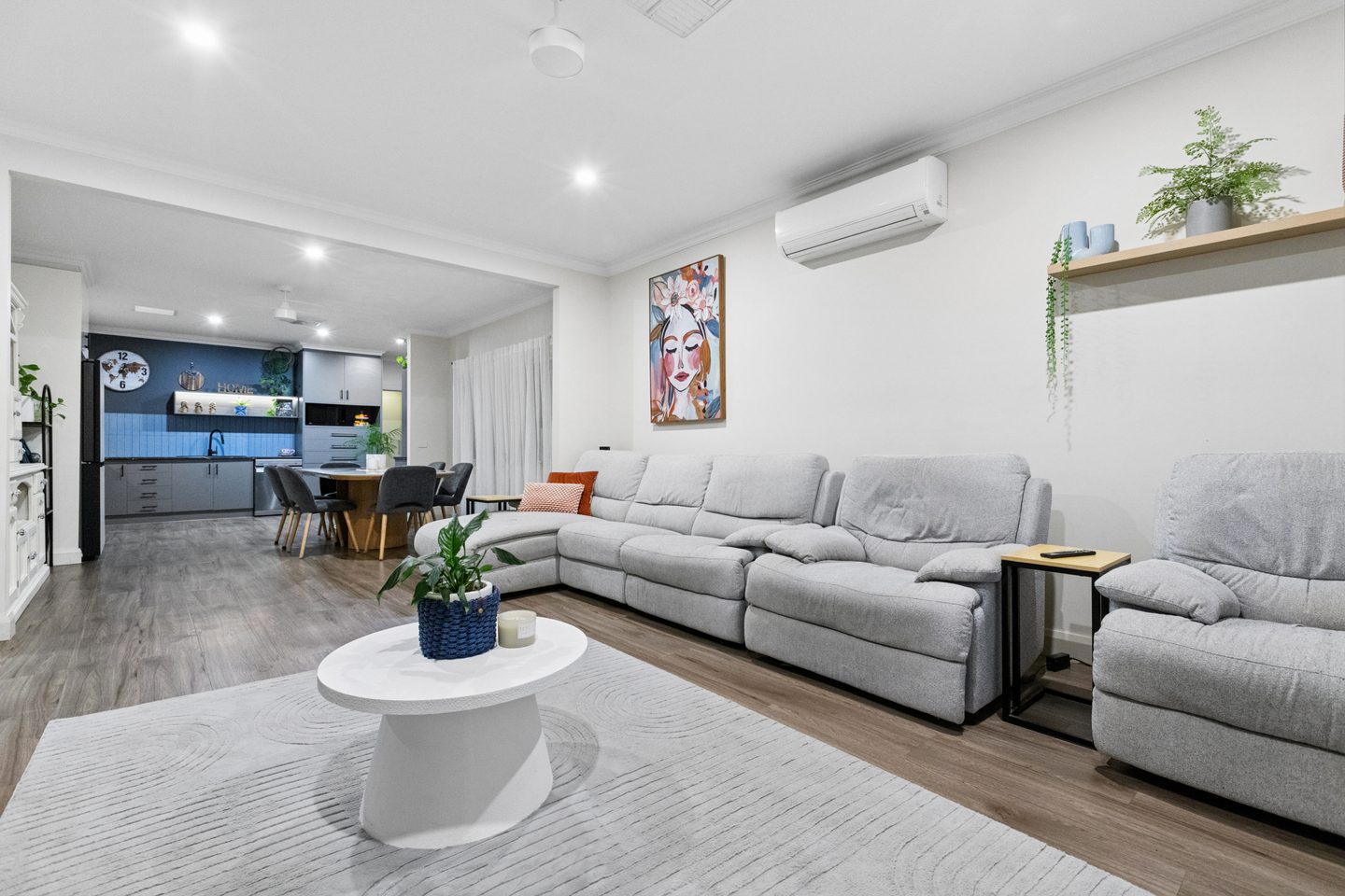 Open-plan living looking towards the kitchen and dining area