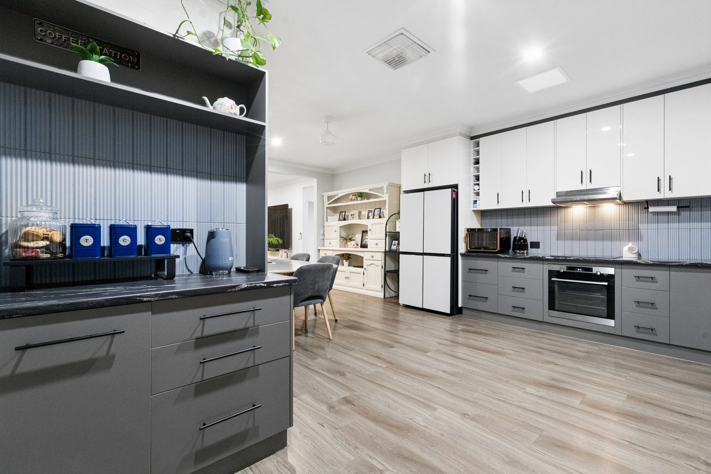 The main residence kitchen, with grey and white cabinetry