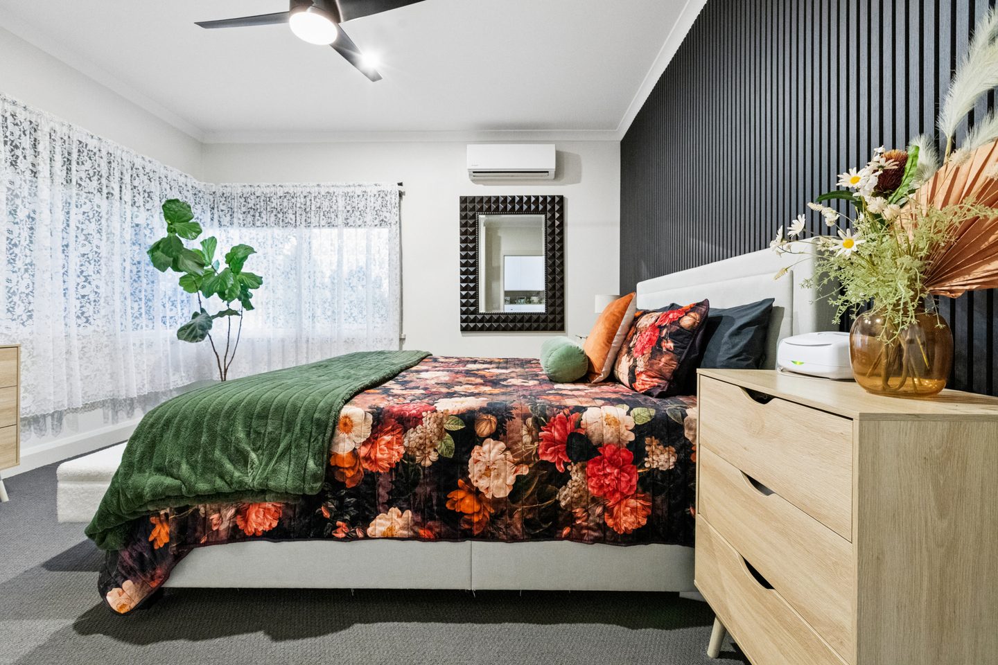 Main bedroom with dark feature wall