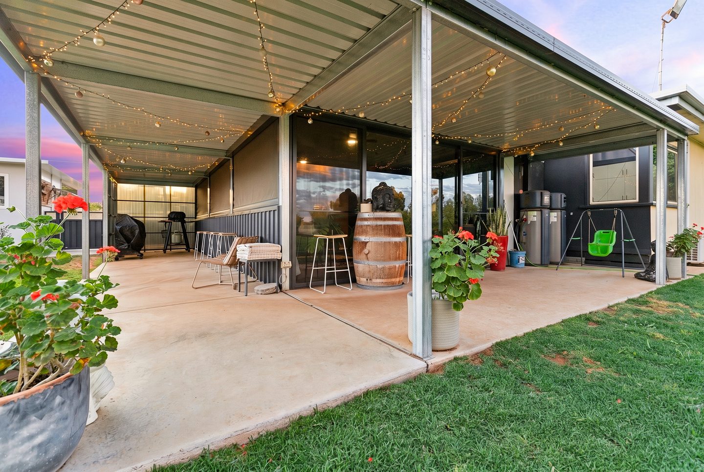 Covered patio beside the lawn