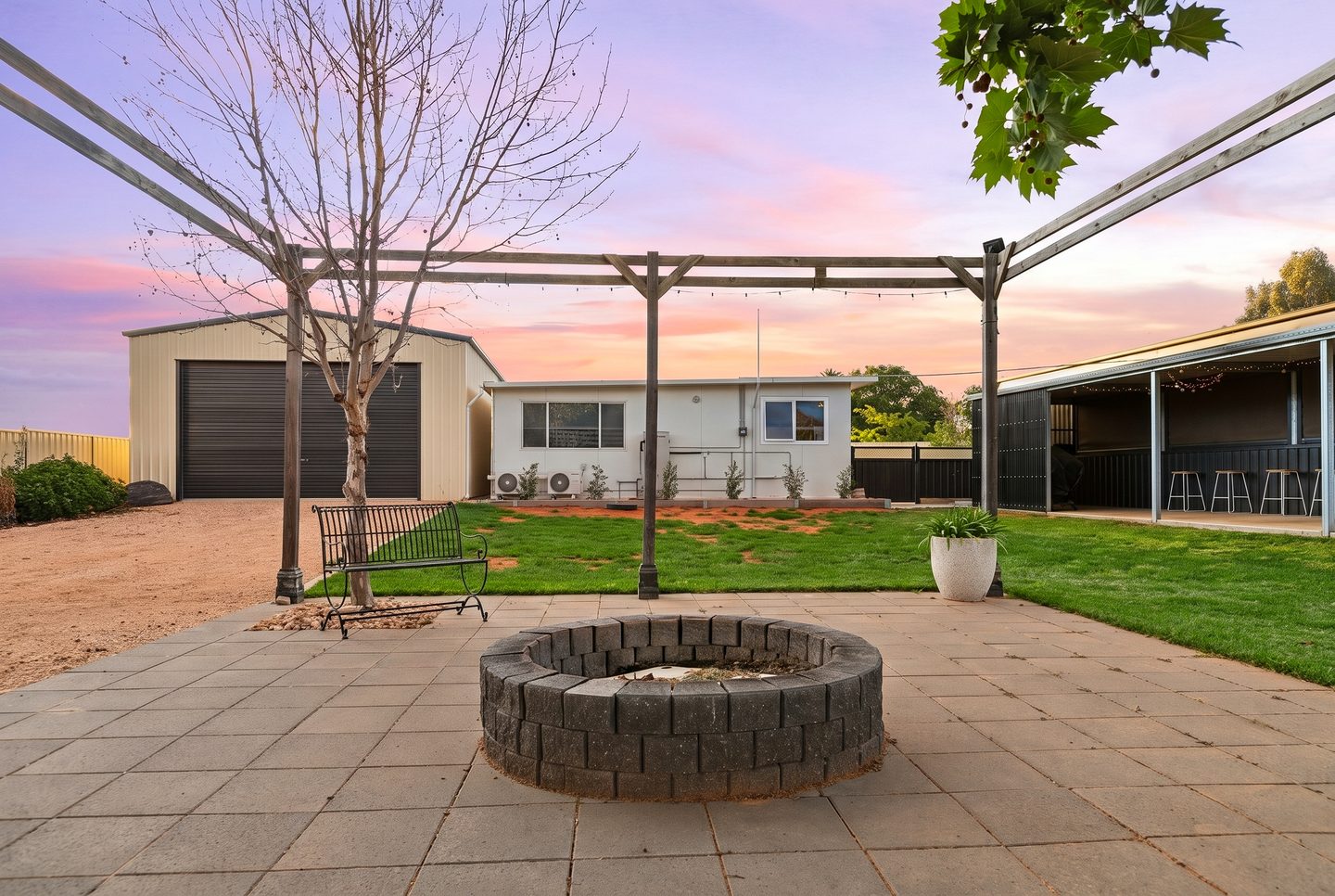 The firepit looking towards the bungalow