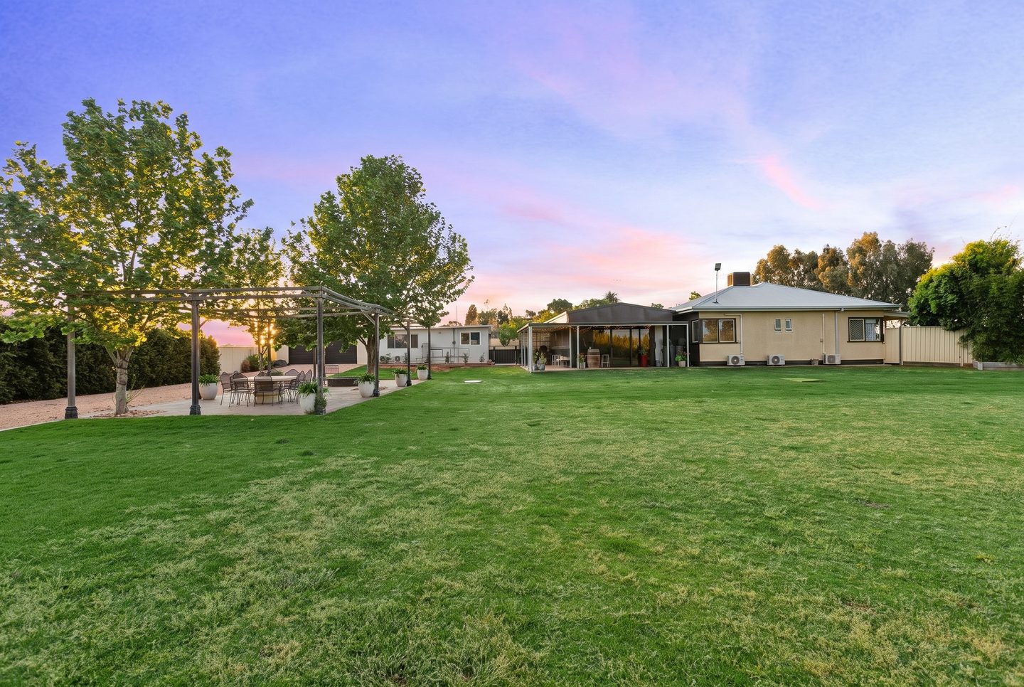 The home and its established gardens at dusk