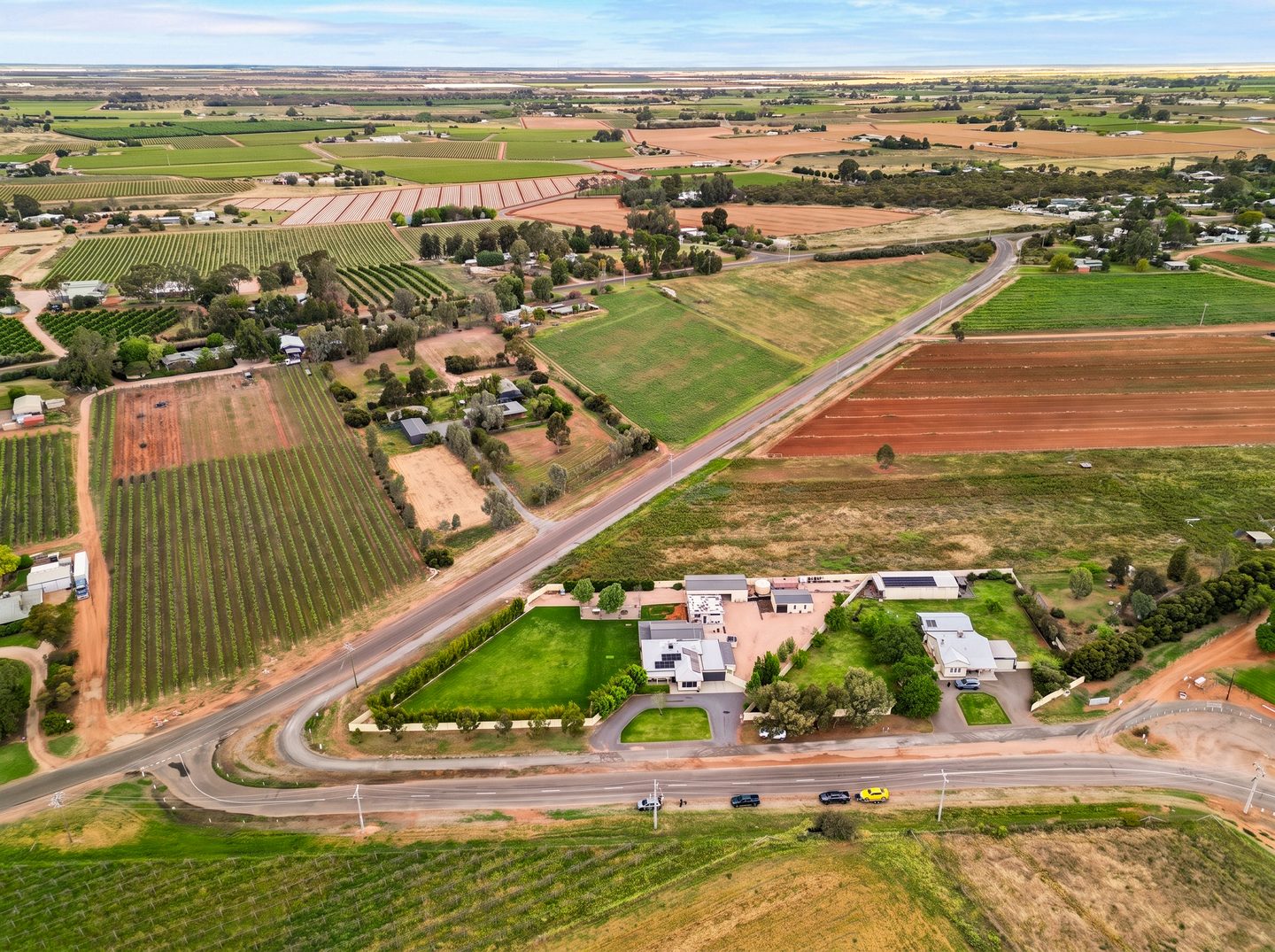Aerial view of the home and the surrounding Red Cliffs landscape